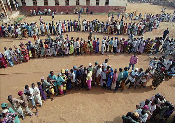 Multiple lines of people waiting to vote.